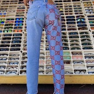 Levi pants with Gucci print on opposite legs